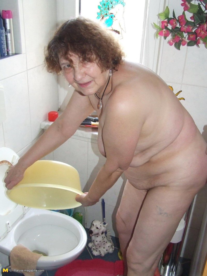 Naked grandmother in the kitchen