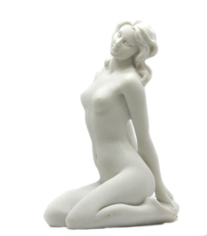 Figurine girl on stone