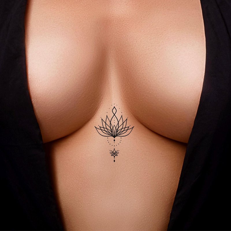 Lotus tattoo between the sternum