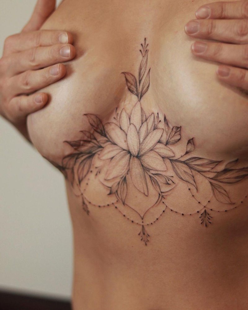 Under the chest tattoo