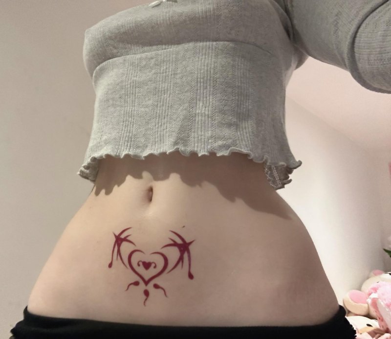 Suckkuba tattoo on the stomach