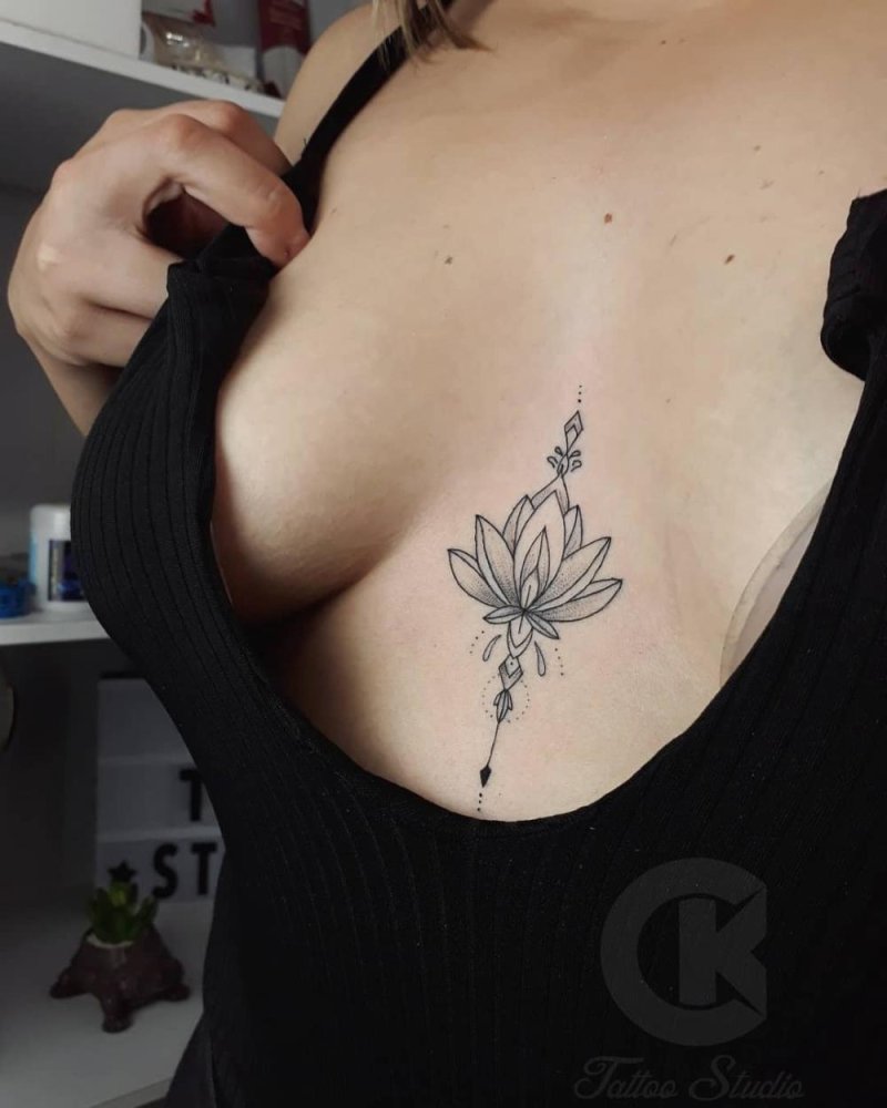 Lotus tattoo between the sternum