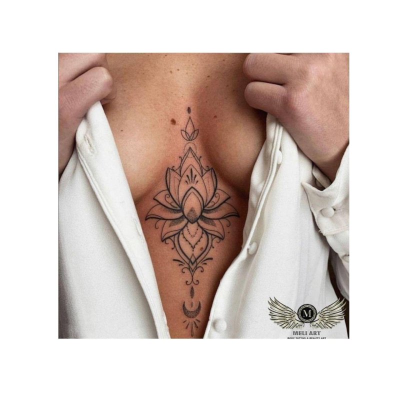 Female tattoos between the sternum