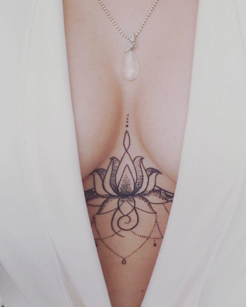 Lotus tattoo under the chest