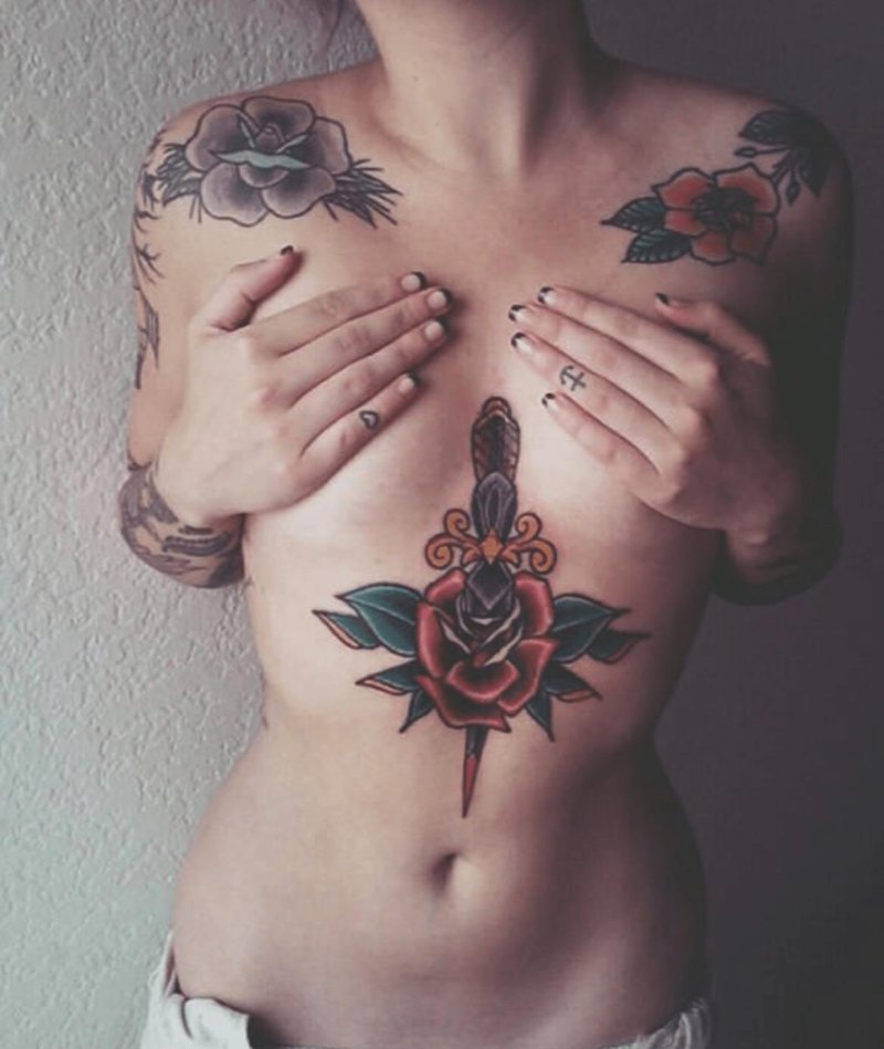 Tattoo dagger on the chest