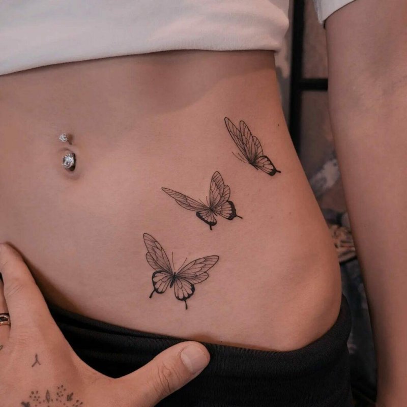 Tattoo butterfly on the stomach