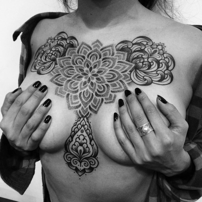 Tattoo mandala on the chest
