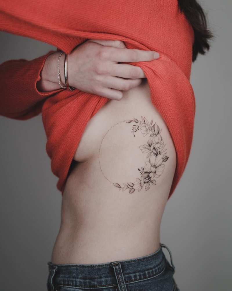 Round tattoo on the ribs