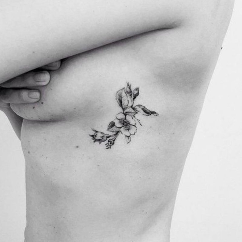 Tattoo flower on the collarbone