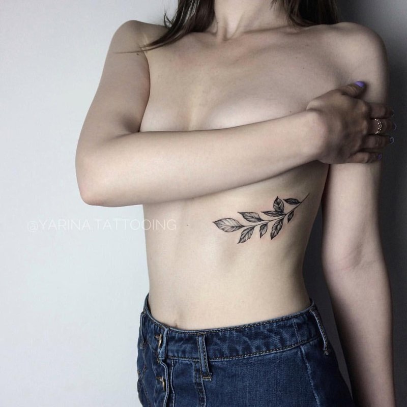 Tattoo twig under the chest