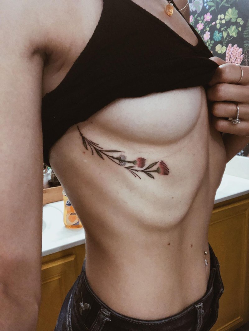 Under the chest tattoo