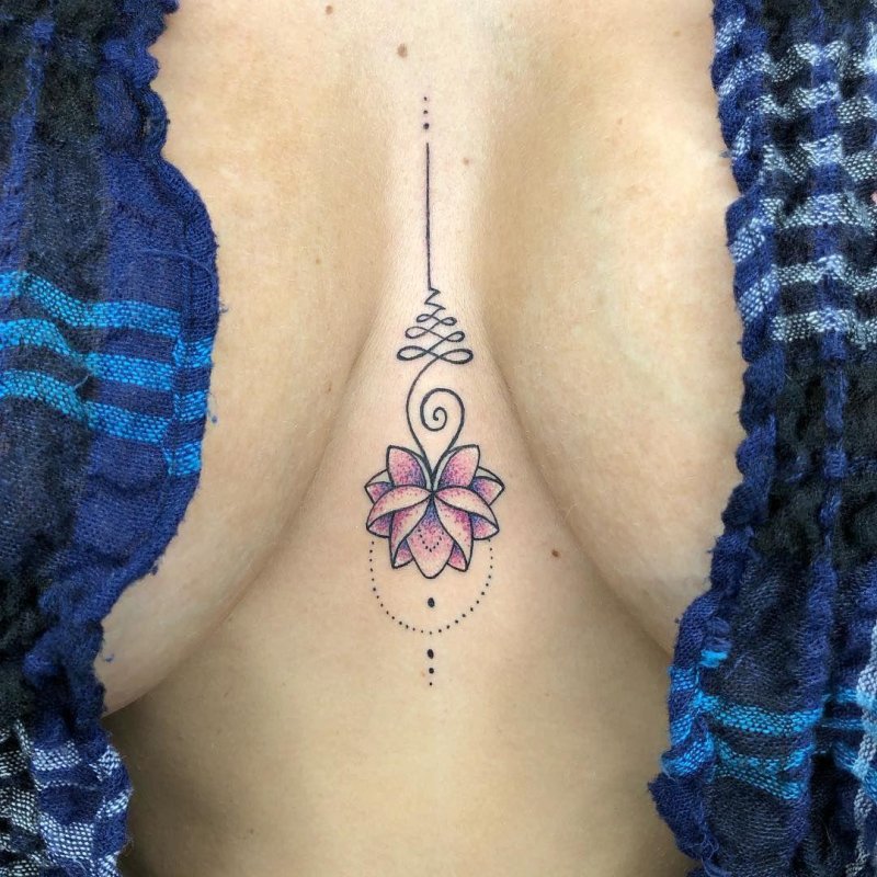 Lotus tattoo between the sternum