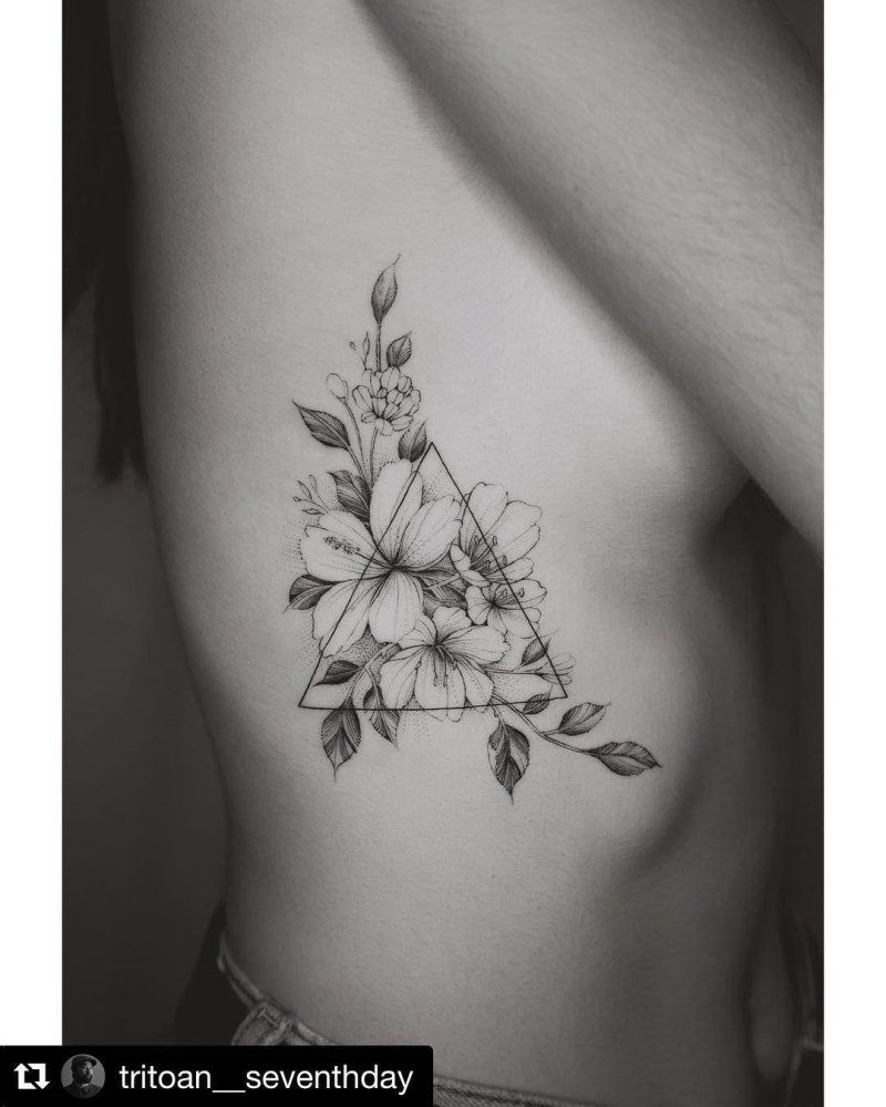 Tattoo twigs under the chest