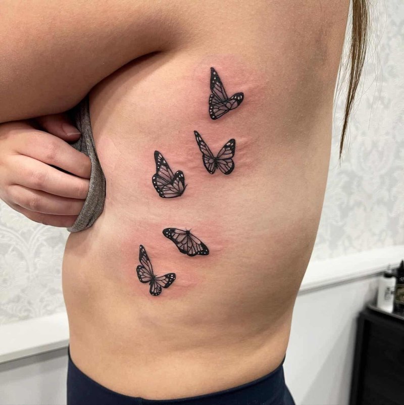 Butterfly tattoo on the ribs