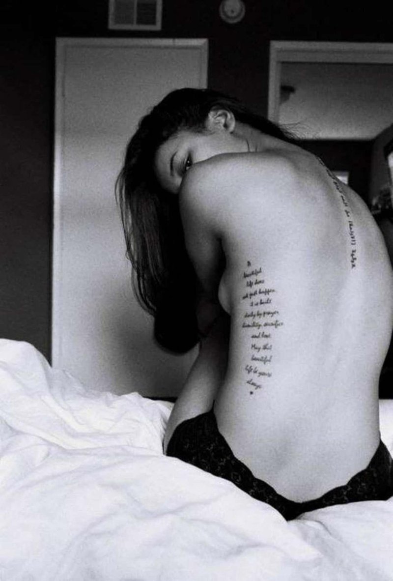 Girl with a tattoo on her back