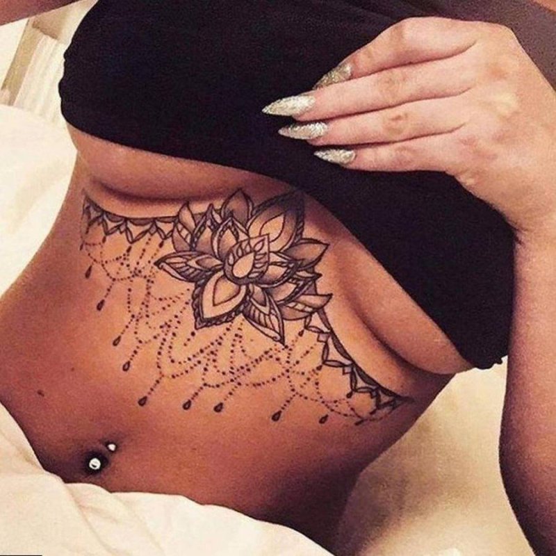Female tattoo under the chest