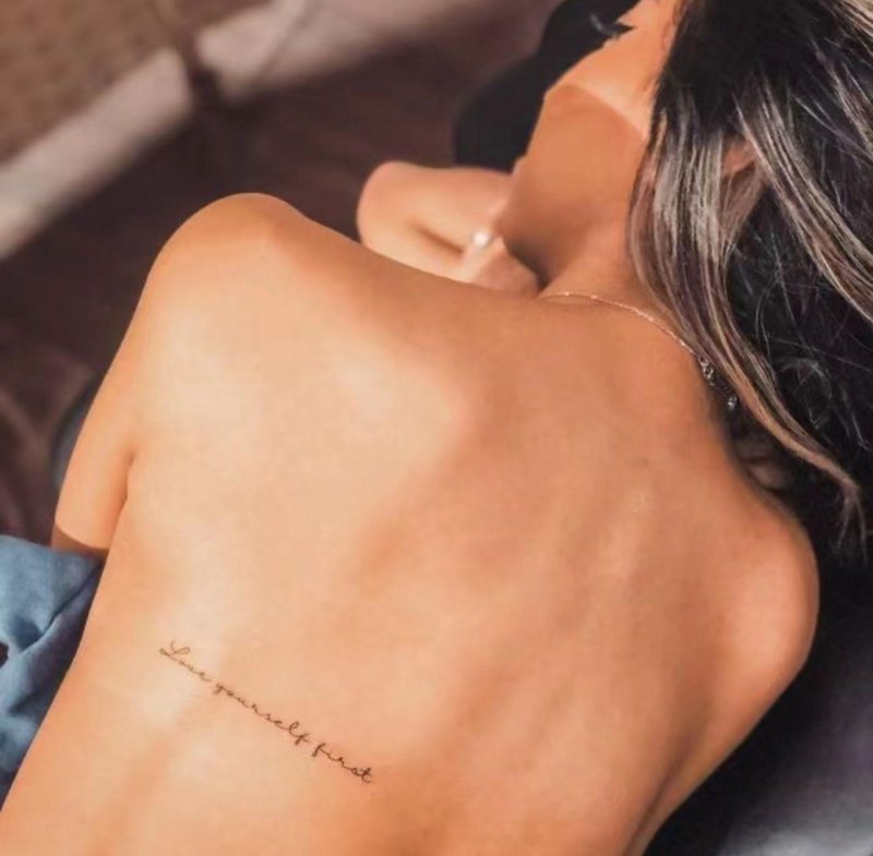 Tattoo along the spine