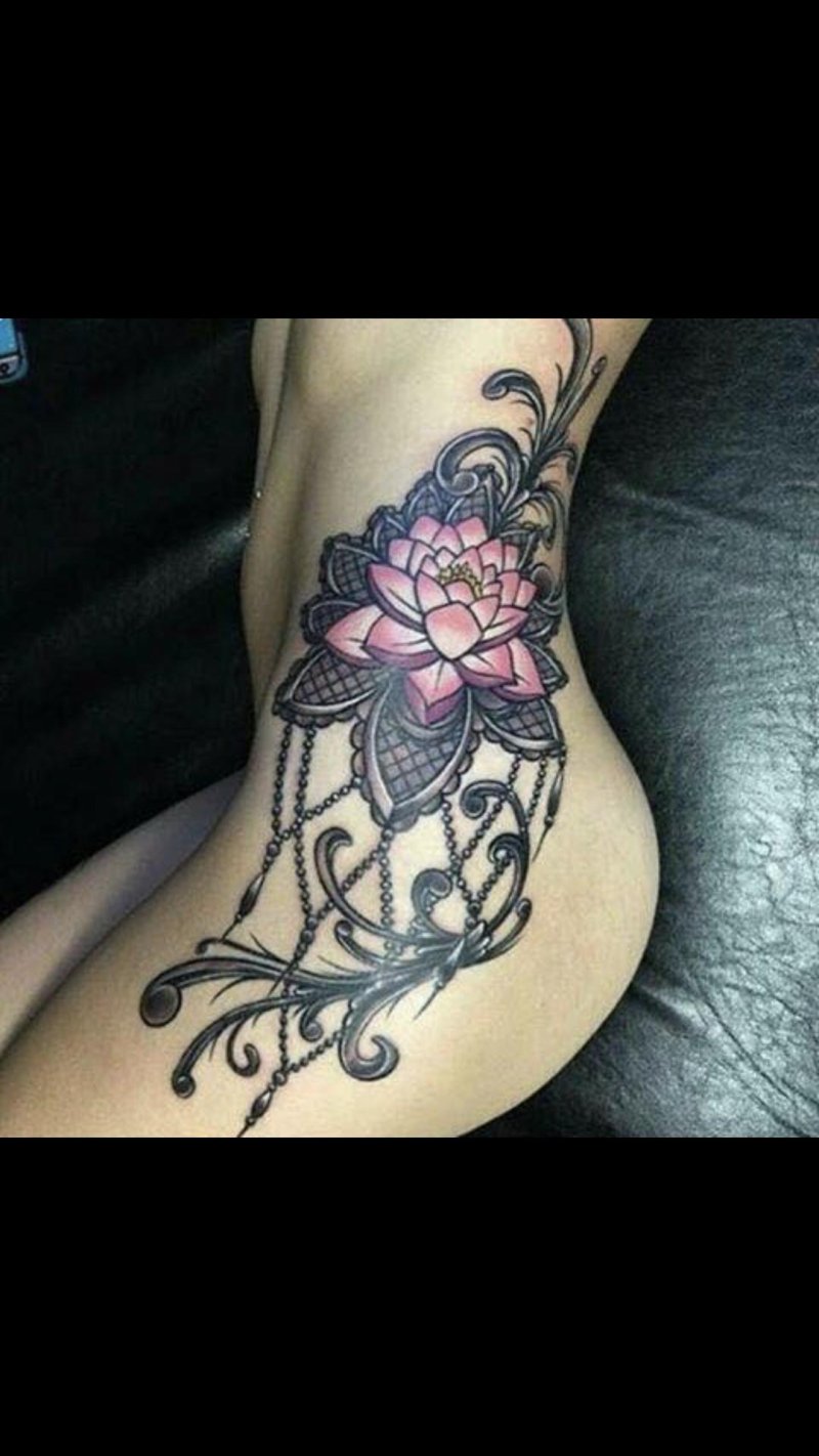 Lotus tattoo on the thigh