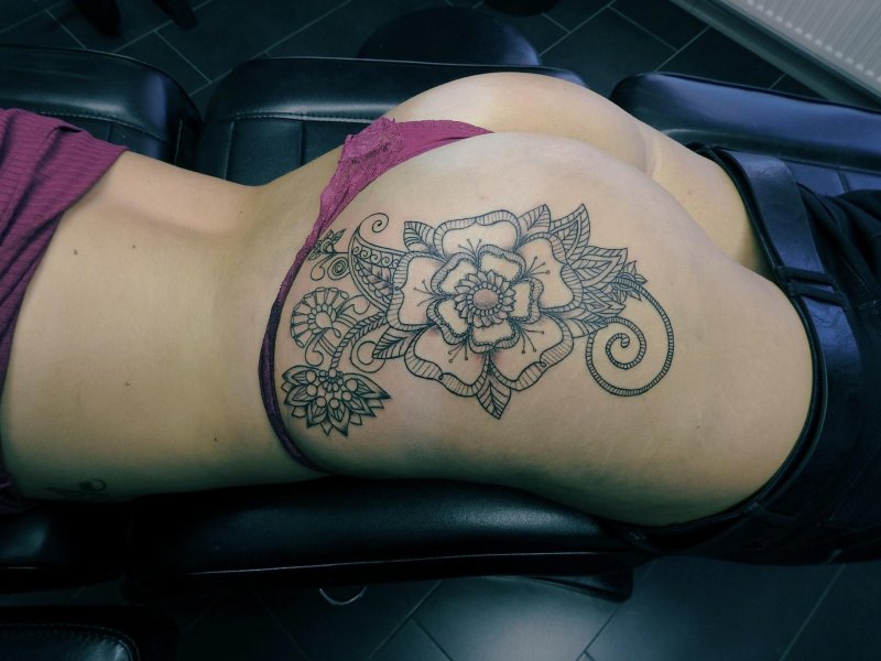 Tattoo on the thigh female