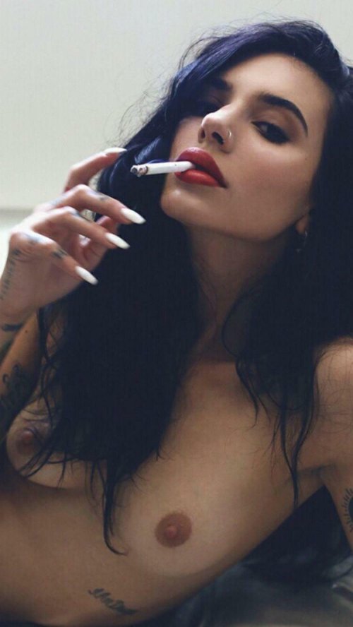 Naked brunette with a cigarette