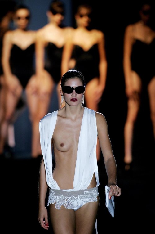 Naked fashion model on the catwalk