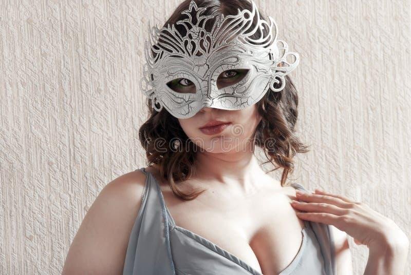Girl in a carnival mask