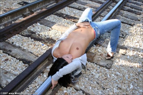 Undresses on the railway