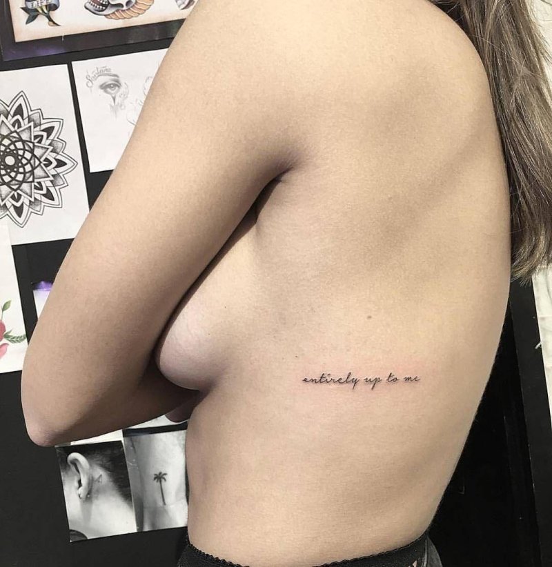 Tattoo under the chest inscription